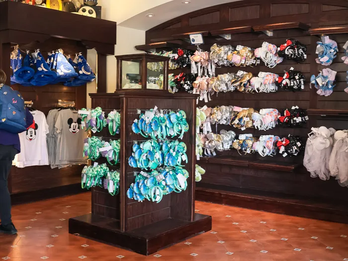 Inside the Studio Photo shop, with a display of Mickey ear headbands and film reels