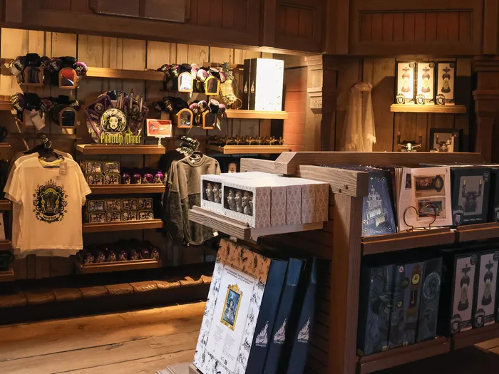 Phantom Manor merchandise section (T-shirt, mugs, gift sets) at the Thunder Mesa Mercantile Building