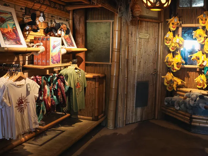 Inside the Indiana Jones Adventure Outpost shop at Disneyland Paris: clothes, soft toys and expedition decor.