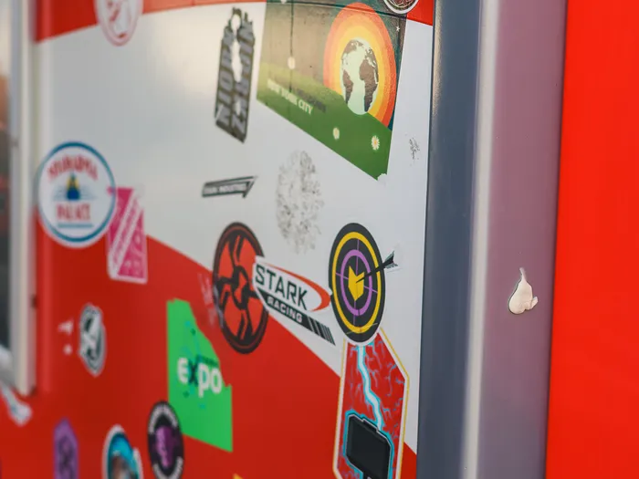 Side of the FAN-tastic Food Truck at Disneyland Paris covered in Marvel stickers: Hulk, Captain America’s shield, Stark Racing and Vibranium