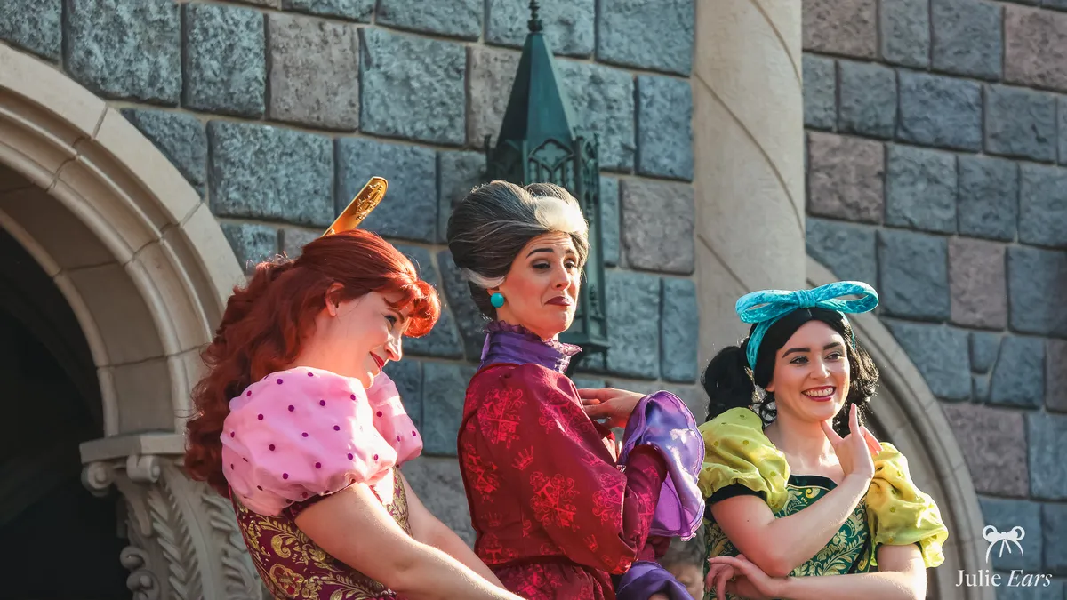 Lady Tremaine, Cinderella’s stepmother, with her daughters Anastasia and Drizella on a balcony of the castle at Disneyland Paris.