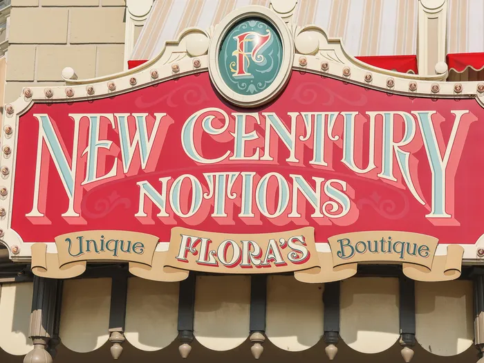 Ornate New Century Notions sign, Flora’s Unique Boutique, on Main Street U.S.A.