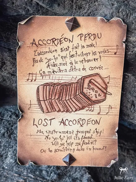 "Lost accordion" poster in the Adventure Isle caves, Disneyland Park: a drawn accordion among musical staves and a rhyming plea in French and English