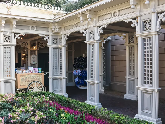 The pushchair and wheelchair hire pavilion at Disneyland Paris, surrounded by flowerbeds.