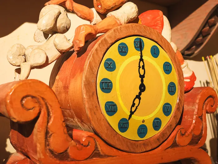 Carved wooden clock featuring Pinocchio, in La Bottega di Geppetto at Disneyland Paris.