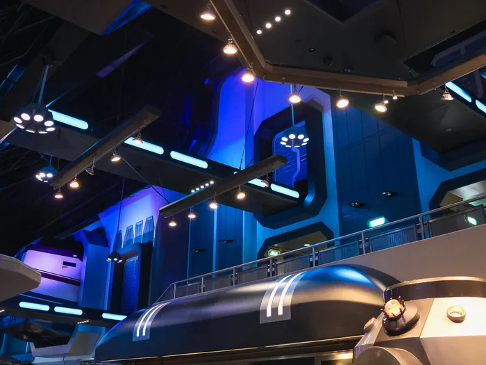 Inside the Star Traders shop at Disneyland Paris, with futuristic decor and bluish lighting