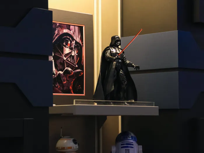 Darth Vader figure and BB-8 and R2-D2 droids on display in the Star Traders shop