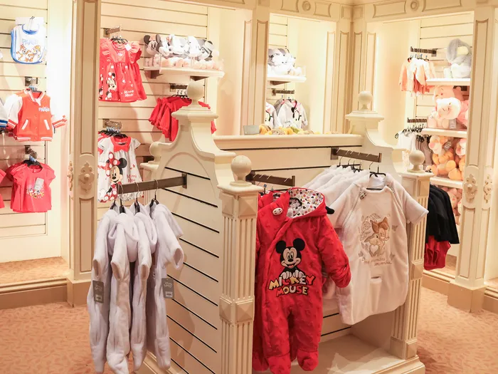 Baby section at Disney Clothiers at Disneyland Paris: Mickey and Minnie bibs, dresses, pyjamas and bodysuits for little ones.