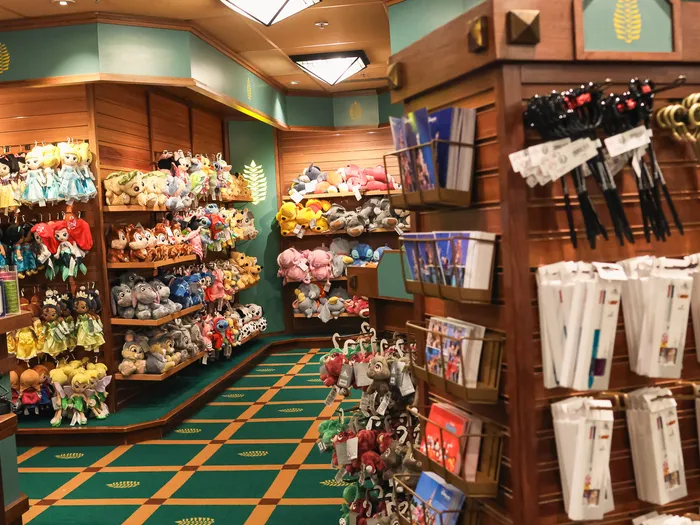 Corner of the Northwest Passage shop with a wall of soft toys, postcards and hanging pens