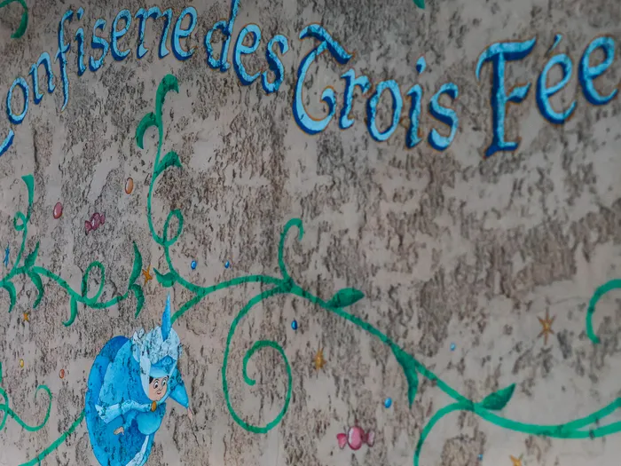 "La Confiserie des Trois Fées" mural with a fairy, at Disneyland Paris.