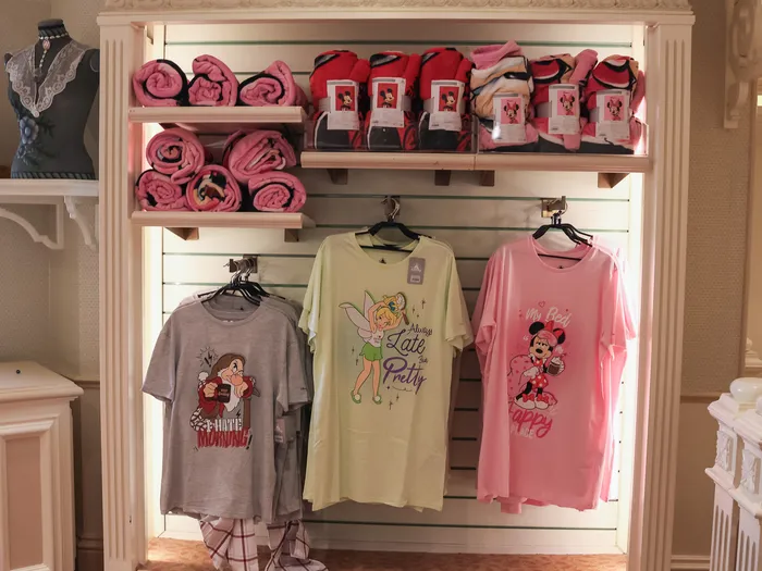 Nightwear and throws section at Disney Clothiers at Disneyland Paris: nightdresses featuring a Disney princess, Tinker Bell and Minnie.