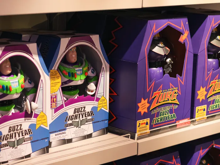 Talking Buzz Lightyear and Emperor Zurg figures in their boxes, lined up on the shelves of the Animation Boutique at Disneyland Paris.
