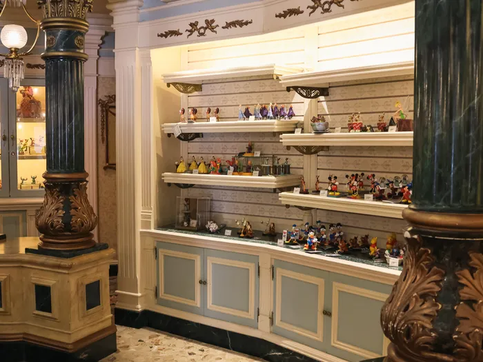 Collectible figurine section at Harrington’s at Disneyland Paris, between the marble columns.