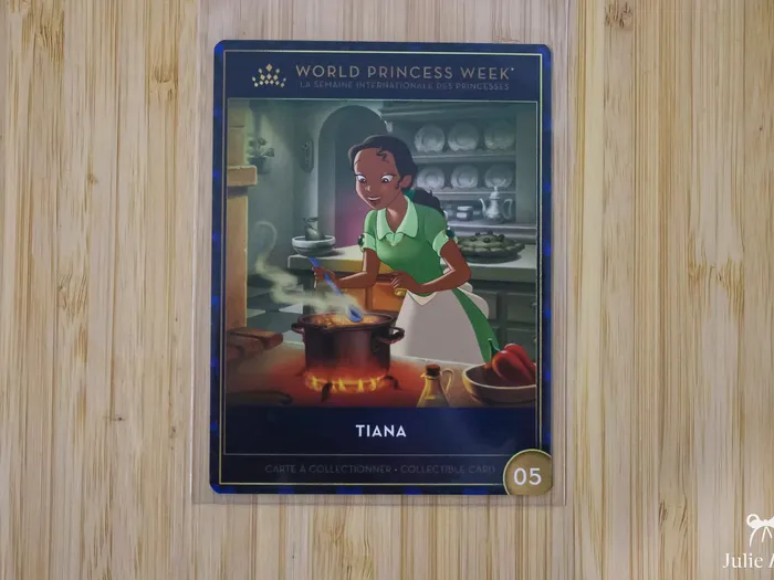 Carte World Princess Week illustrant la princesse Tiana en train de cuisiner devant un chaudron