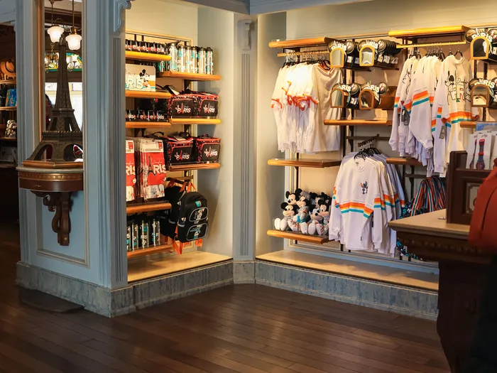 Inside New Century Notions: bags, white T-shirts and an Eiffel Tower lamp on the shelves