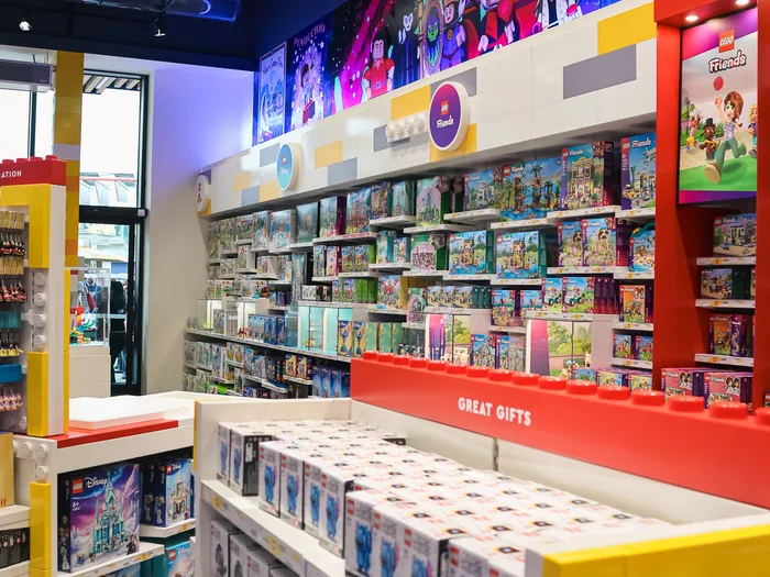 Shelves of LEGO boxes and a Great Gifts display in The LEGO Store.