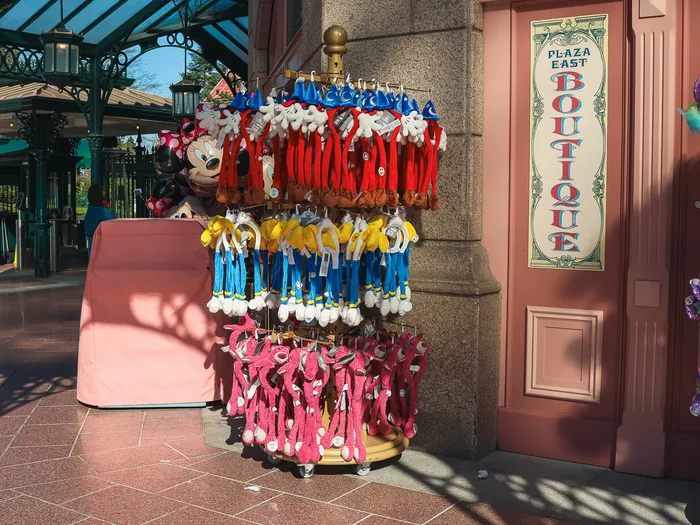 Outdoor display of Mickey ear headbands near the entrance to the Plaza East Boutique