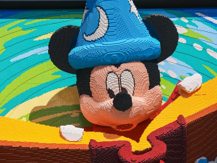 Close-up of the LEGO sculpture of Sorcerer Mickey in his starry blue hat.