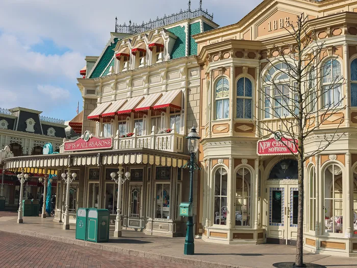 Main Street U.S.A. lined with Victorian buildings, New Century Notions facade on the right