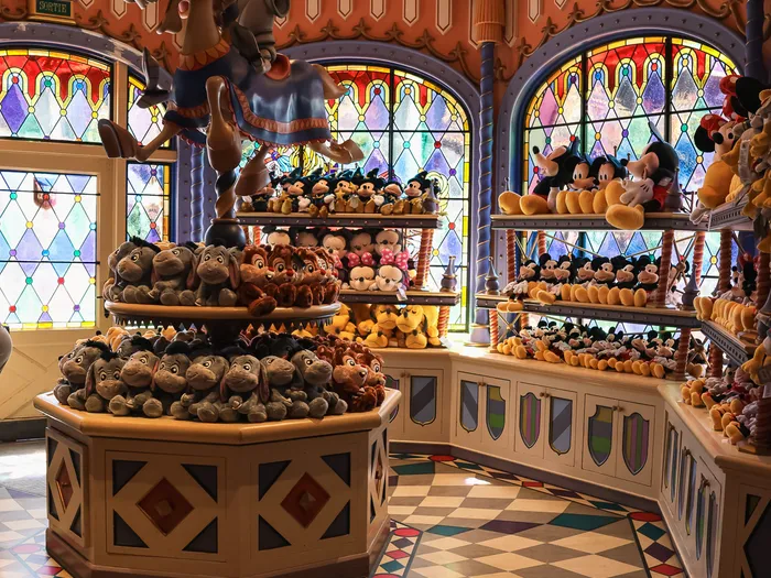 Inside Sir Mickey’s Boutique: big-top ceiling, stained glass and shelves of Disney soft toys