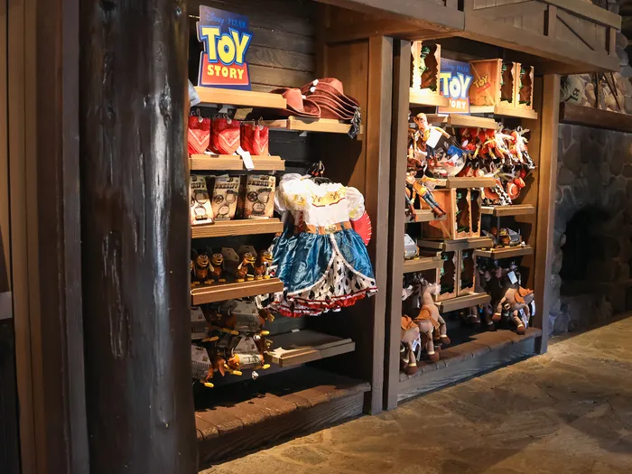 Toy Story merchandise (hats, Jessie dress, soft toys) at Disneyland Paris