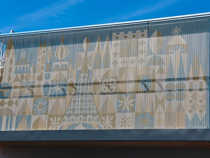Decorated facade of the Disney Glamour shop at Disney Village under a blue sky