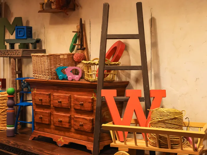 Section of wooden toys and objects in La Bottega di Geppetto at Disneyland Paris.