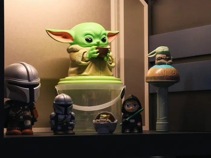 Grogu figure and Mandalorian helmets among the Star Wars products at Star Traders
